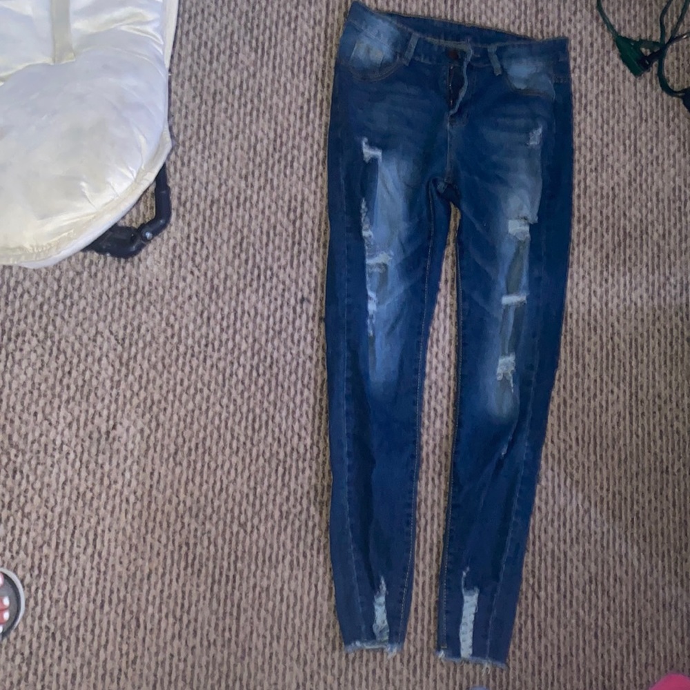 Skinny ripped jeans with a stretchy waist area. Unworn.